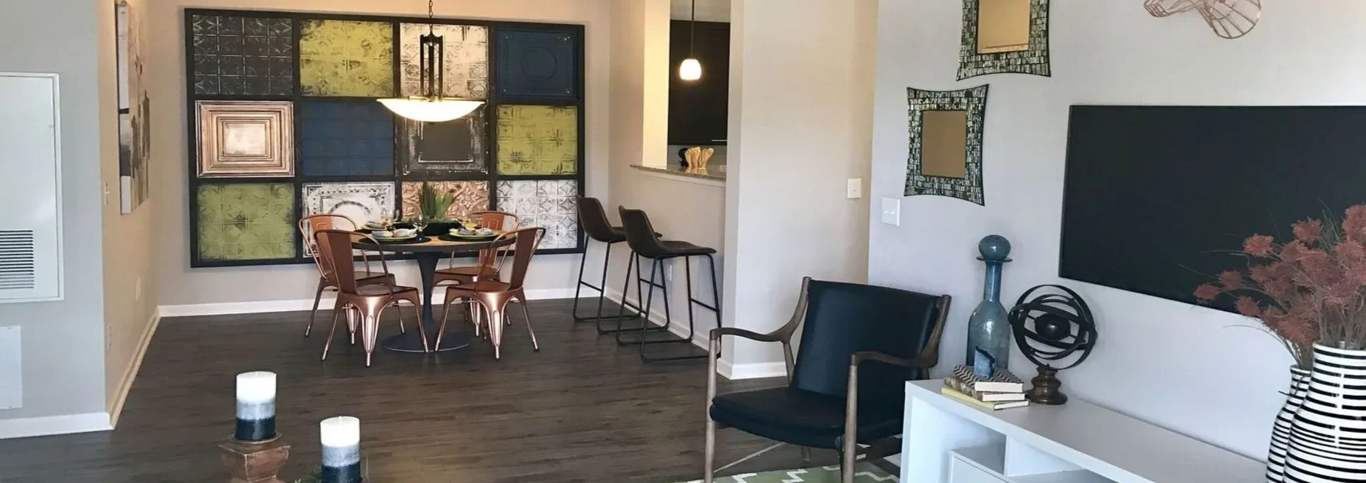 a living room and dining area with green walls at The Creekside at Kenneys Fort