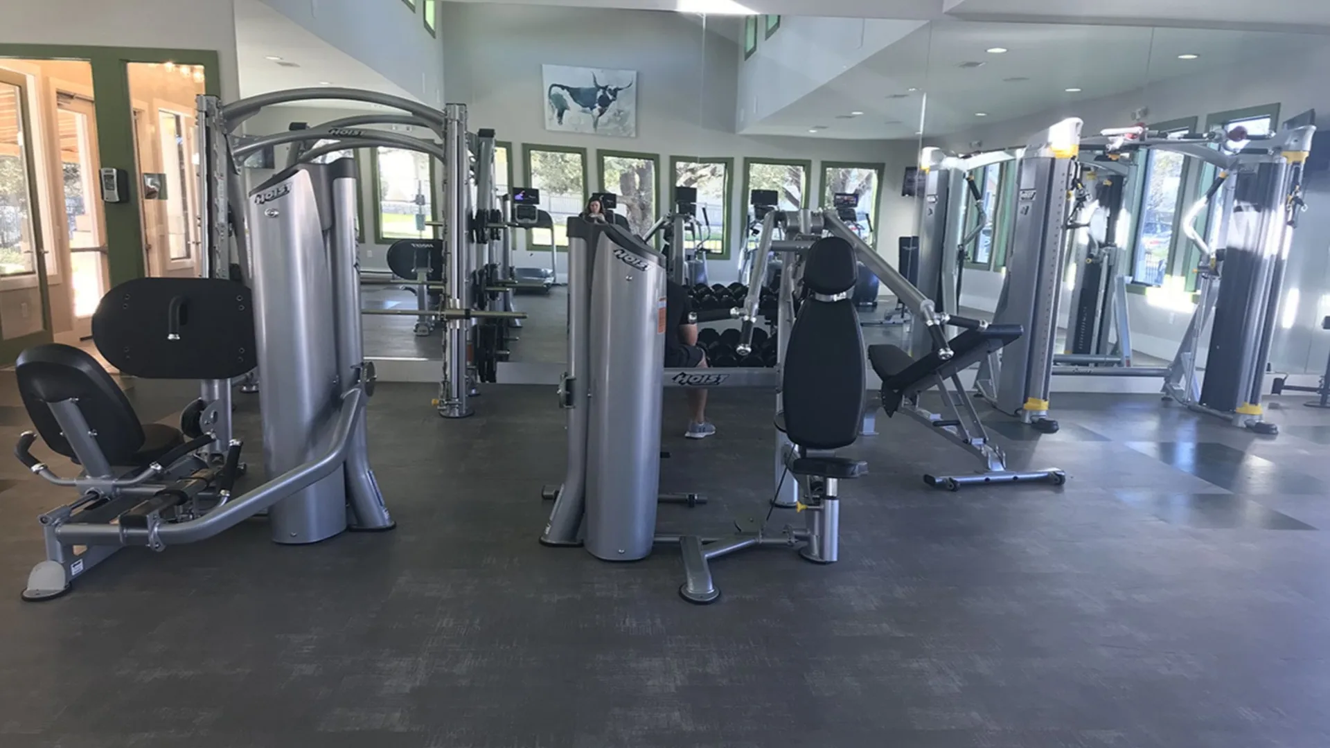 a gym with many machines and equipment at The Creekside at Kenneys Fort