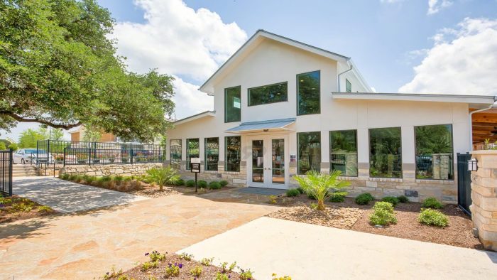 the front entrance to a home with a driveway and landscaping at The Creekside at Kenneys Fort