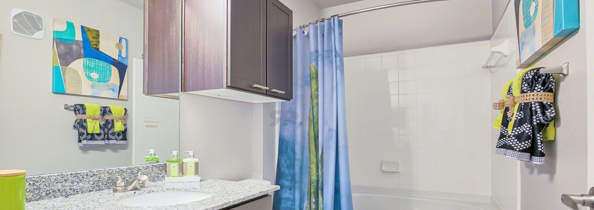 a bathroom with a shower, sink and toilet at The Creekside at Kenneys Fort